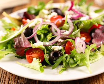 Salad with onions, tomatoes, and olives
