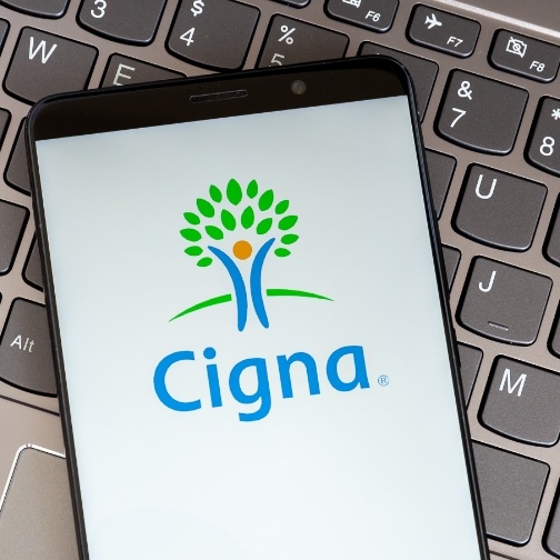 Phone screen showing logo for Cigna dental insurance