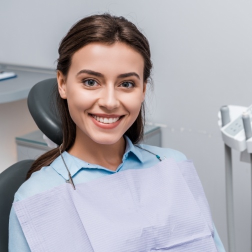 Young woman smiling in dental chair