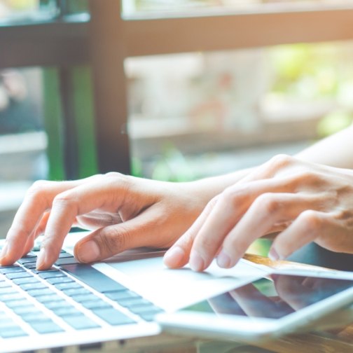 Person typing on laptop