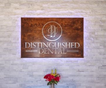 Large plaque on wall that reads Distinguished Dental