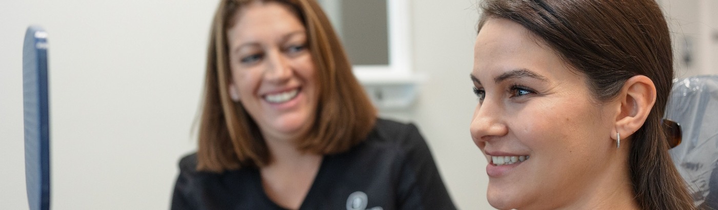 Fort Worth dentist Doctor Sheri McIntosh smiling at a dental patient