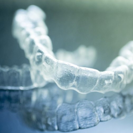 Two clear aligners on a tray