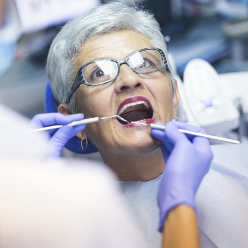 Senior woman receiving a preventive dentistry checkup in Fort Worth