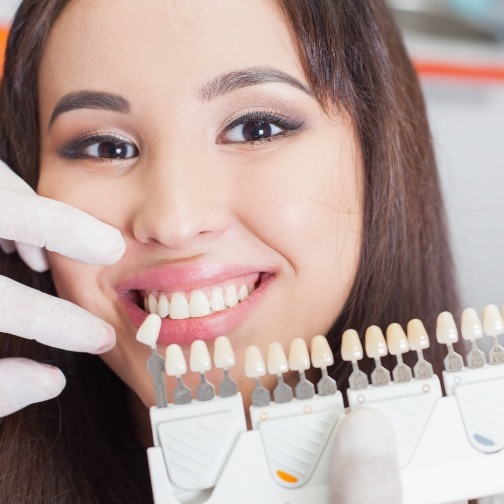 Young woman in dental chair getting veneers in Fort Worth