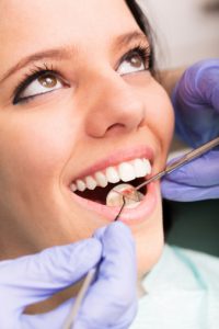 smiling woman during dental exam