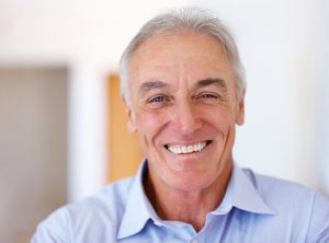 How should I clean my dentures in Keller?