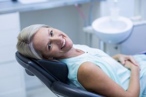 Happy woman in the dental chair.