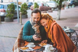 Couple enjoying breakfast at a café.