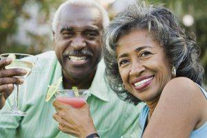 Senior couple enjoying a drink.