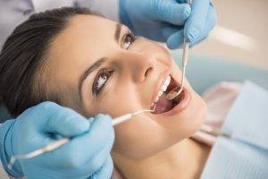 Woman having dental examination. 