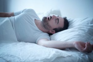 Man breathing through his mouth while sleeping.