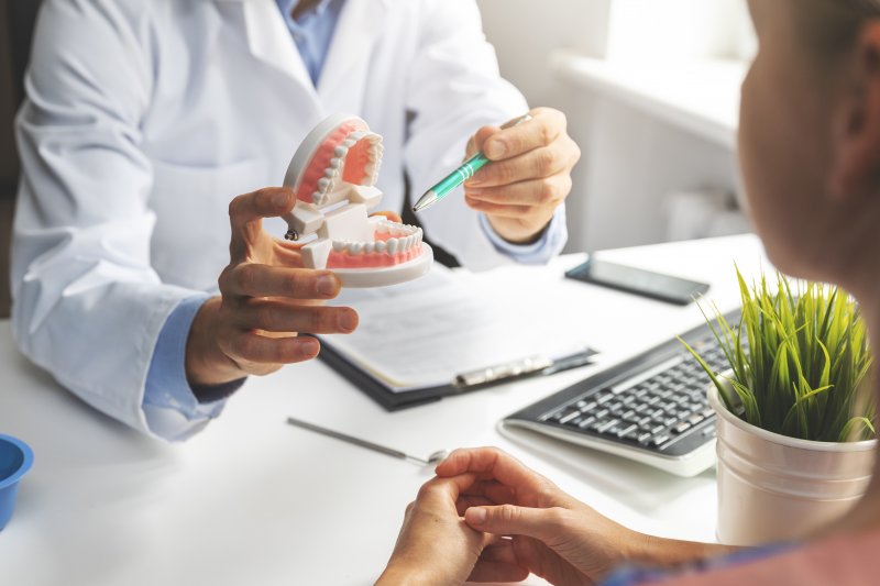 person undergoing a dental implant consultation in Fort Worth