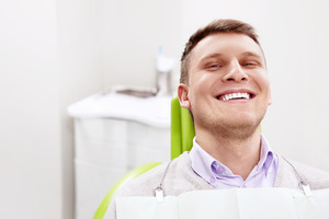 Male dental patient smiling during his checkup